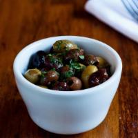 House-Cured Olives · Picholine and taggiasca olives marinated in extra virgin olive oil, thyme and garlic. One pi...