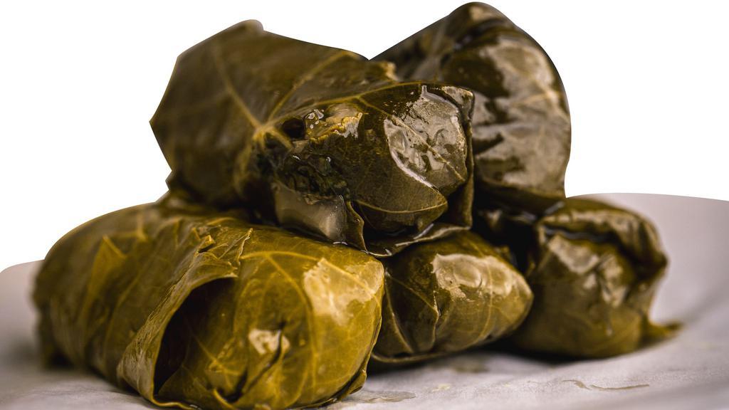 Dolmades · Our vine leaves stuffed with basmati rice, herbs and spices.