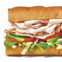Turkey Breast Footlong · Dive into tender turkey breast piled sky-high with everything from lettuce and tomatoes to b...