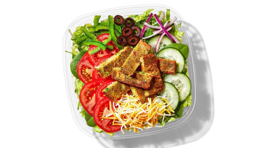 Veggie Patty Chopped Salad · Whether by choice or simply for a delicious change, a full-flavored veggie patty chopped salad with your favorite combination of veggies and sauces hits the mark!
