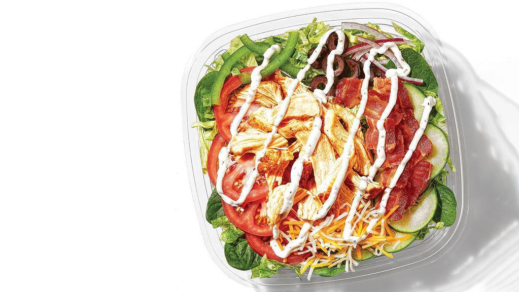 Chicken & Bacon Ranch Chopped Salad · Saddle up & try the Chicken & Bacon Ranch chopped salad. Topped with Monterey cheddar cheese, tender chicken, bacon, lettuce, tomato, onions and green peppers.