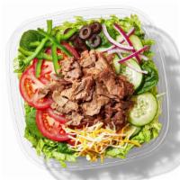 Steak & Cheese Chopped Salad · The two most elemental, irresistible ingredients in the world - piled high on your choice of...