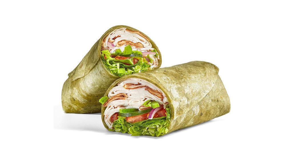 Turkey Breast · Our Turkey Breast Signature Wrap is a go-to. With a double portion of our premium sliced turkey in a spinach wrap. Made just for you with crunchy veggies and sauces.