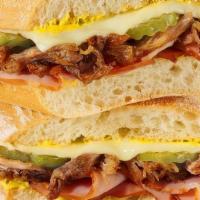 Cubano Sandwich · pulled pork, applewood smoked ham, swiss cheese, dill pickle chips, yellow mustard on a ciab...