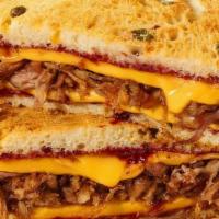 Jalapeno Cheddar Melt W/ Roasted Pork · Roasted pulled pork, sharp cheddar, raspberry chipotle spread, on butter toasted Jalapeno Ch...