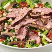 Sear-Ious Steak Salad · Seared flank steak, roasted portobello mushroom, organic arugula, chopped romaine, roasted g...