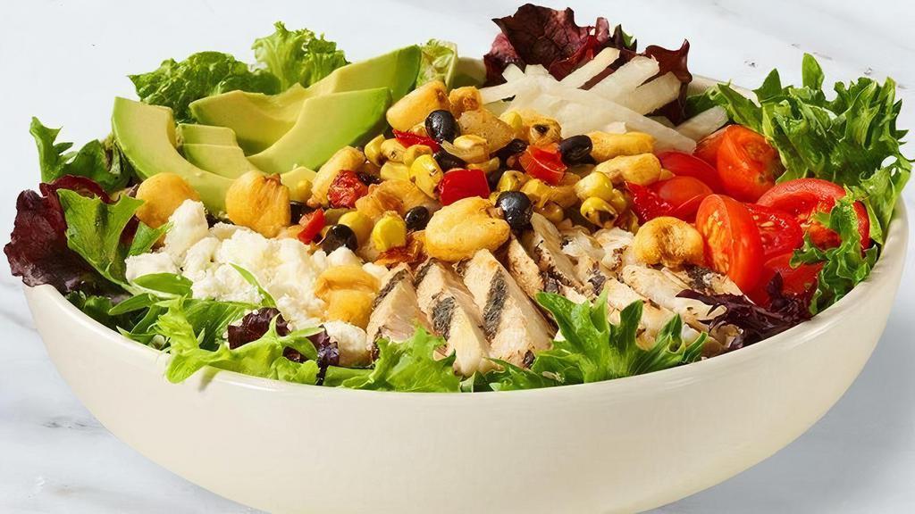 Southwest Chicken Salad · Chicken breast, fresh avocado, jicama, fire roasted corn, black beans, bell peppers and onions, grape tomatoes, Feta cheese, crunchy Peruvian chile lime corn, southwestern ranch dressing