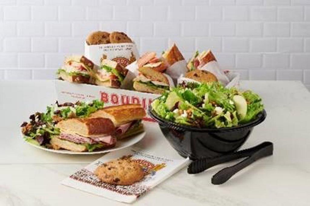 Sandwich And Salad Family Meal For 4 · The perfect family meal served on the bread that made us famous.  This meal includes 4 whole sandwiches, choice of Spring or Classic Caesar *Salad for 4 and 4 yummy baked cookies for dessert.  *Add Chicken for $6.89 more. Excludes hot sandwiches. No substitutions or modifications.