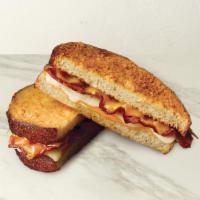 The Great Grilled Cheese With Bacon · Applewood smoked bacon, Havarti & sharp cheddar cheese melted to perfection on Parmesan-crus...