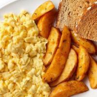 Traditional Breakfast · Scrambled eggs, applewood smoked bacon, potato wedges, toast and jam.