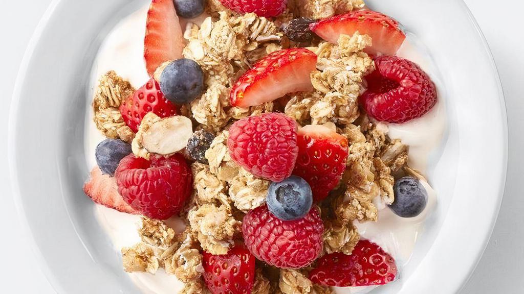 Granola & Greek Yogurt Parfait · Greek vanilla yogurt with fresh seasonal berries and crunchy granola.