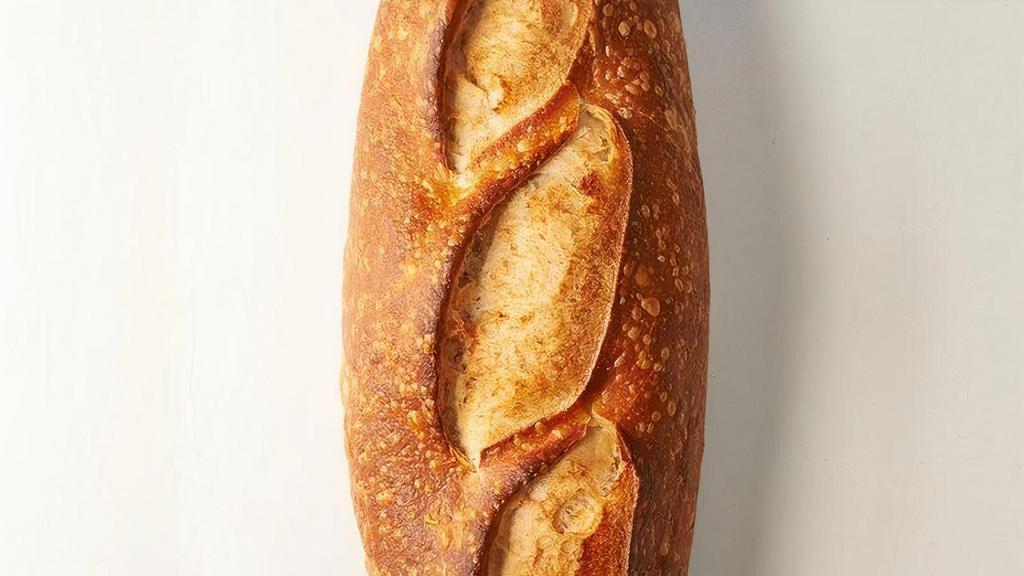 Sourdough Long · Slightly crustier than the round loaf, but softer than the baguette, this is among our most popular breads.