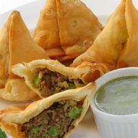 Meat Samosa · Pastry with ground lamb and peas