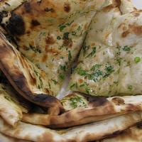 Favorite Bread Basket · A combination of garlic naan, onion kulcha and naan