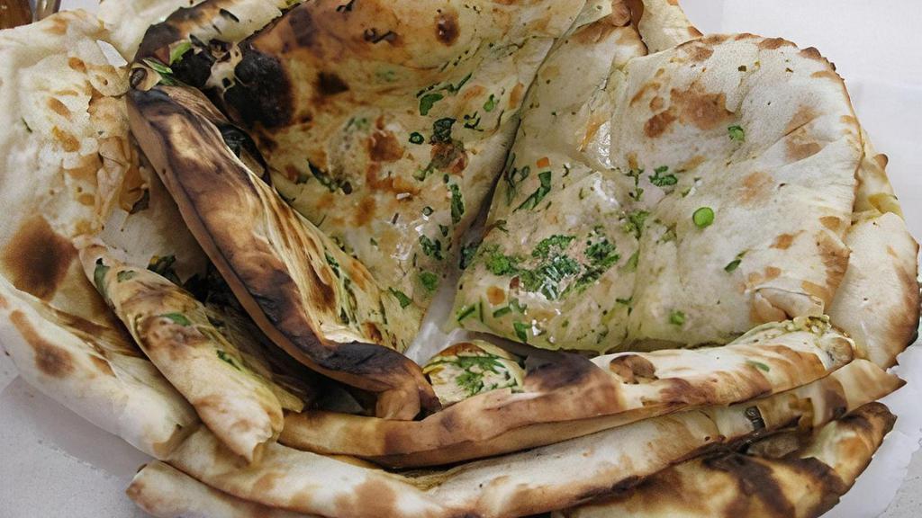 Favorite Bread Basket · A combination of garlic naan, onion kulcha and naan