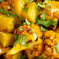 Aloo Gobi · Potatoes and cauliflower cooked with spices