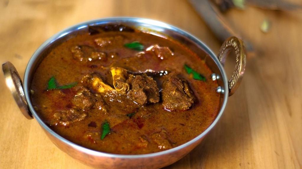 Goat Curry · Goat cooked with spicy sauce