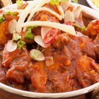 Karahi Chicken · Chicken cooked with onions and bell peppers in a spicy sauce