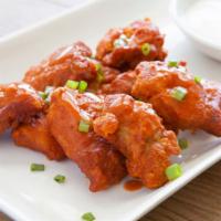 Chicken Tenders with Buffalo Sauce · Delicious Halal Chicken Tenders served with a side of Buffalo sauce.