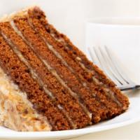 The Carrot Cake · Sweet and moist spice cake, full of cut carrots and toasted nuts, and covered in cream chees...