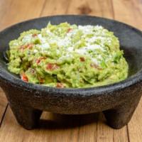 Fresh Guacamole · Fresh Hass avocados, diced jalapeños, pico de gallo, topped with fresh lime juice and cotija...