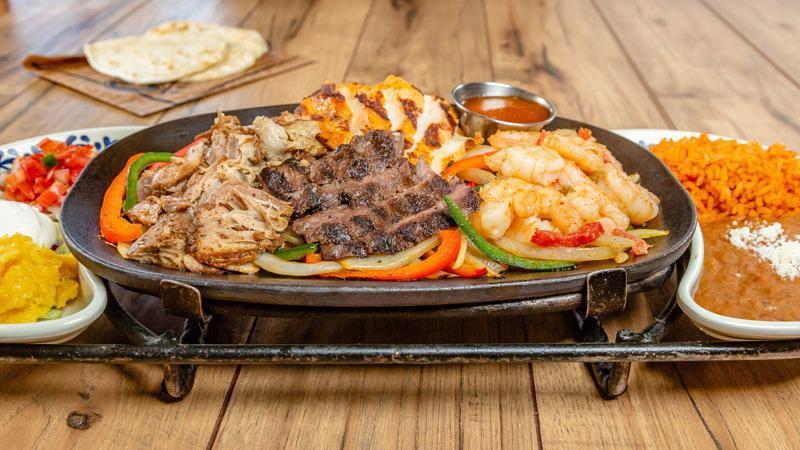 Mixed Grilled Fajitas · The best of the best! Mesquite-grilled chicken breast marinated in fresh citrus and chiles, marinated and flame-grilled steak, Mexicampi Shrimp and slow-roasted carnitas.