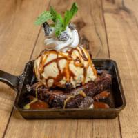 Ooey-Gooey-Chewy Sundae · Fresh-baked brownie and rich vanilla ice cream drenched in homemade Cajeta caramel and  choc...