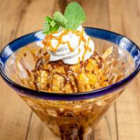 DEEP-FRIED ICE CREAM · We roll our creamy vanilla ice cream in a crispy coating, deep fry it, and serve it up on a ...