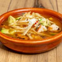 Homemade Tortilla Soup · Rich chicken broth, roasted corn, tomatoes, jalapeños, chicken, and fresh avocado slices..