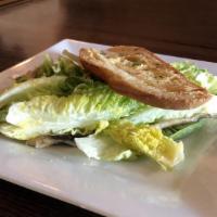 Little Gem Caesar Salad · Boquerones, cured egg yolk, garlic dressing and crostini