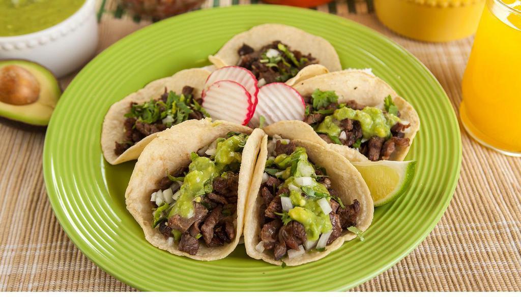 *Taco · A handmade tortilla, meat, cilantro, and onion.