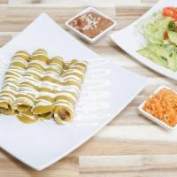 *Enchiladas* · 4 chicken enchiladas, smothered in melted jack cheese and your choice of our house red or gr...