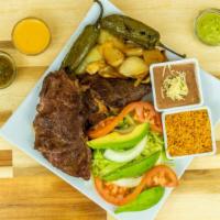 *Platillo de Carne* · Your favorite meat served as a platter with rice, beans, salad, and hand-made tortillas.