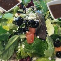 House Salad · Mixed greens, tomato, cucumber, feta cheese with balsamic dressing.