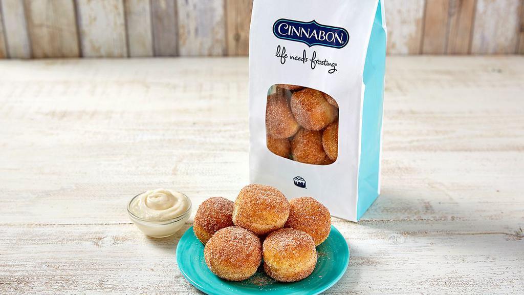 Cinnasweeties™ · Bite-sized doughnut treats, rolled in our famous cinnamon sugar. Comes with an extra cup of frosting to your order to create a dippable sweet treat!
