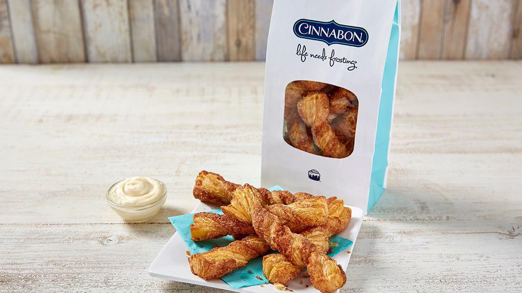 Cinnabon Stix® · Crispy sticks baked fresh with sugar and Makara® cinnamon, served ready to dip. Comes with an extra cup of frosting to your order to create a dippable sweet treat!