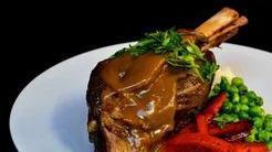 Braised Lamb Shank · Braised lamb shank, slow cooked for 36 hours in a stout and red wine broth, with a side of m...