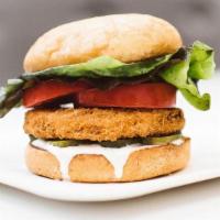 Crispy Chik'N Burger · Golden Fried Crispy Chik'n Patty, Organic Dill Pickles, Organic Lettuce, Organic Tomato and ...