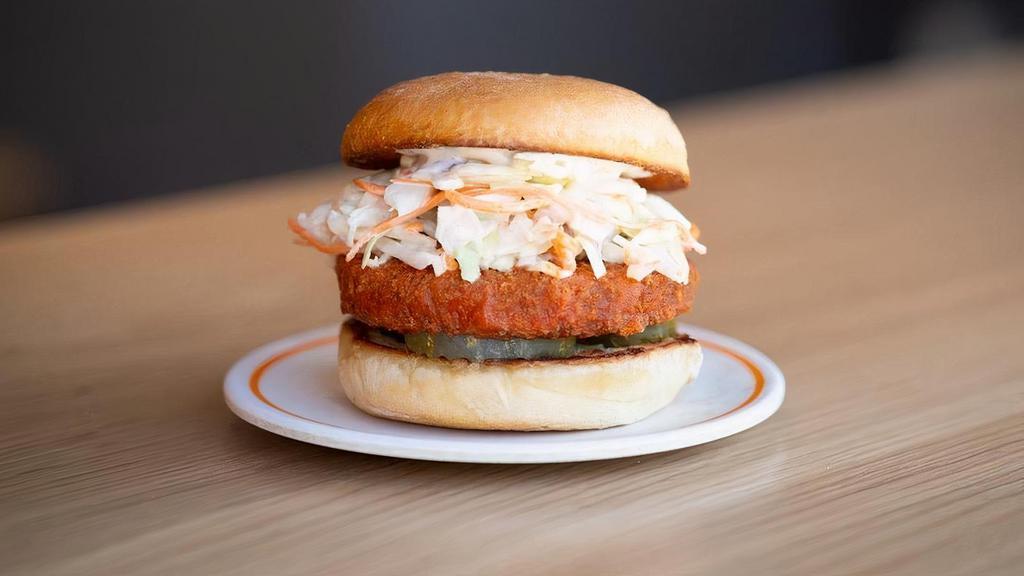 Buffalo Chik'n Burger · Crispy Buffalo Chik'n Patty, Organic House-Made Coleslaw, Organic Dill Pickles and Creamy Ranch. 590 cals / 18g protein   Allergies:. Chik'n Patty contains Gluten & Soy. Organic White Bun contains Gluten & Soy. Ranch contains Soy