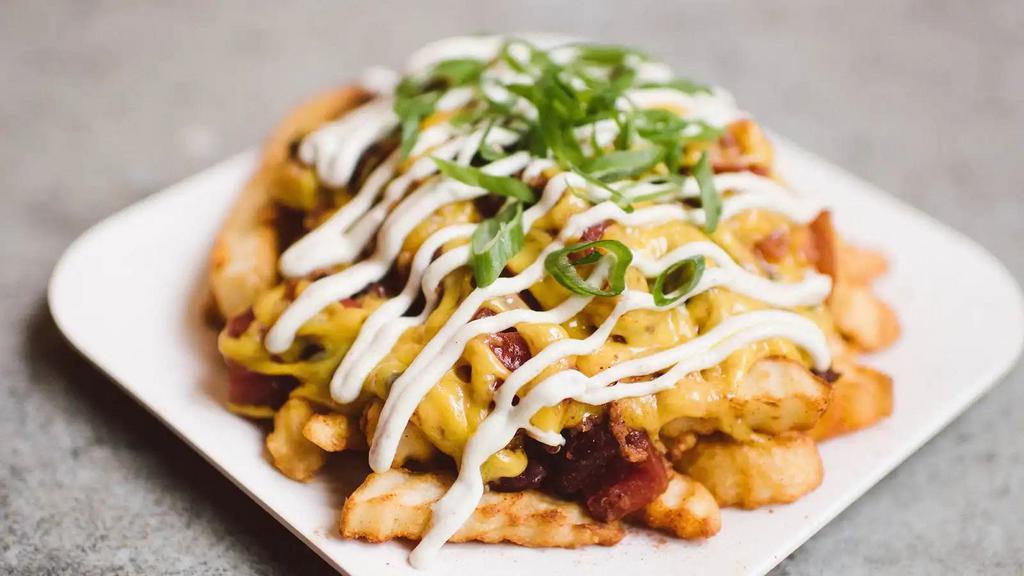 Chili Chz Style Fries · Organic Crinkle Cut Fries Smothered in House-Made Chili and Melted Cheddar Cheese. Topped with Sour Cream and Organic Green Onions..  810 cals, 13g pro. Allergies:. Sour Cream Contains Cashews. Fried Fries are Deep Fried with Gluten & Soy Products