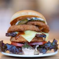 Maverick CluckWich · Breakin' Rules with a Crispy CluckPatty topped with Onion Rings, Organic Tempeh Bacon, Organ...