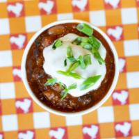Side Cluckchili · Our House-Made & Organic 3-Bean Chili. Topped with Sour Cream & Organic Green Onions.  Aller...