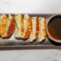 Gyoza · 6 pieces. Japanese style meat pot stickers.
