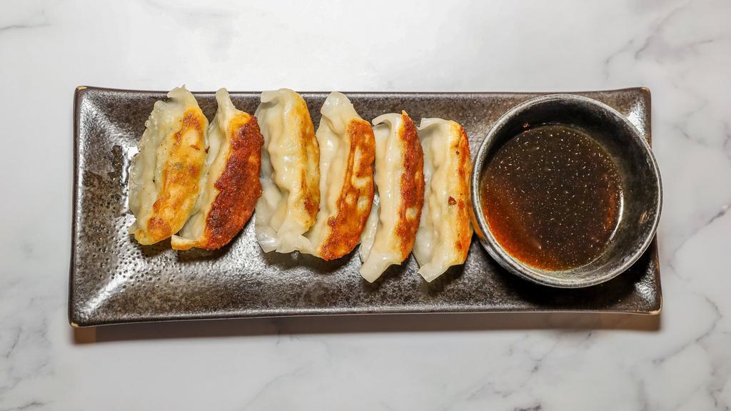 Gyoza · 6 pieces. Japanese style meat pot stickers.