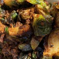 Chorizo Sprouts · Roasted brussel sprouts with chorizo, sauteed with pickled cauliflower and red onions.