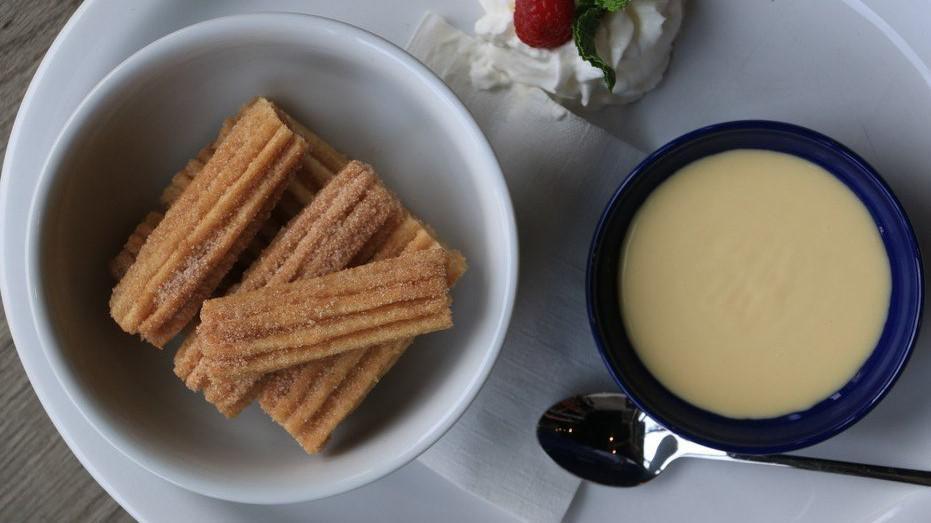 Churro Bites · Served with dulce de leche dipping sauce.