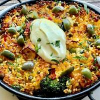 Vegetarian Paella · mushroom, roasted cauliflower, peas, carrot-jalapeño sofrito, saffron, roasted peppers, vege...