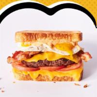 Rise N Shine Melt · Hamburger patty, American cheese, 2 fried eggs, bacon, tomatoes & Awesome Sauce