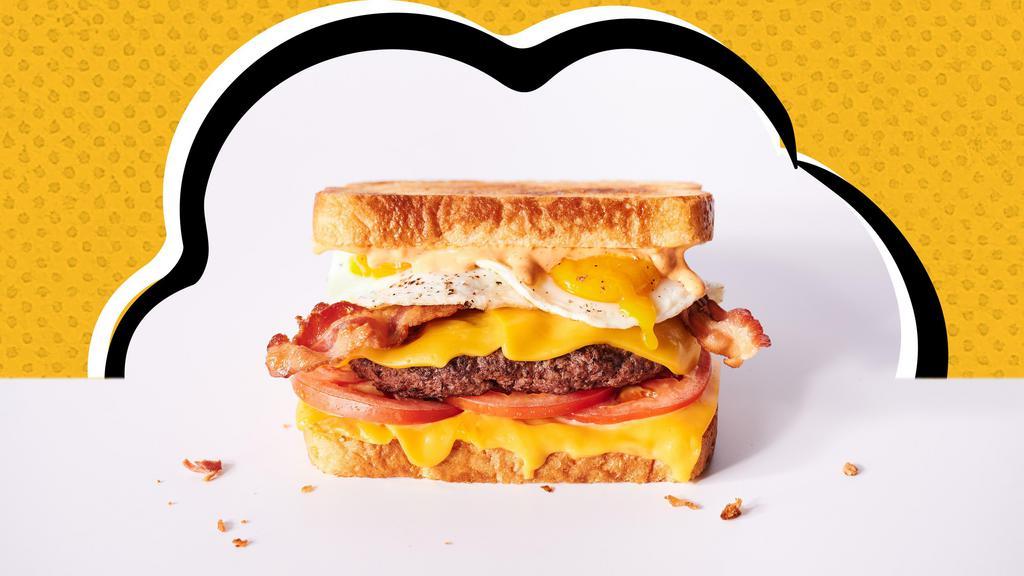 Rise N Shine Melt · Hamburger patty, American cheese, 2 fried eggs, bacon, tomatoes & Awesome Sauce