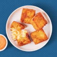 Classic Mac Bites​ · Four golden fried mac & cheese bites served with Awesome Sauce for dipping